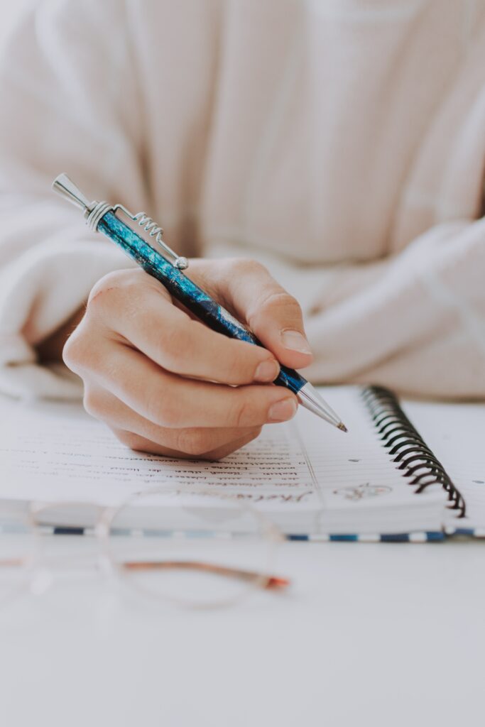 writing essay in notebook